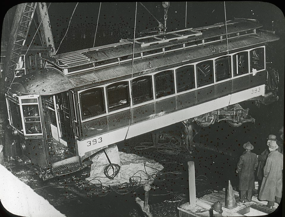 Street Car 393 being raied out of a river